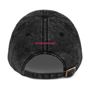 a black hat on top of a black shoe 